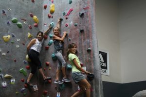 three young girl climbers posing for a photo op
