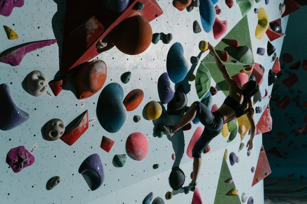 woman climber on a climbing wall