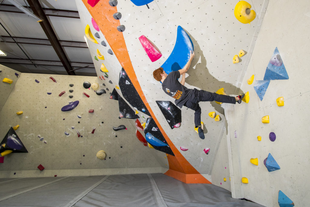 male climber bouldering