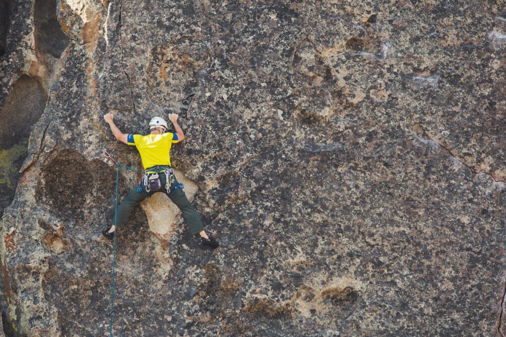 male climber rock climbing